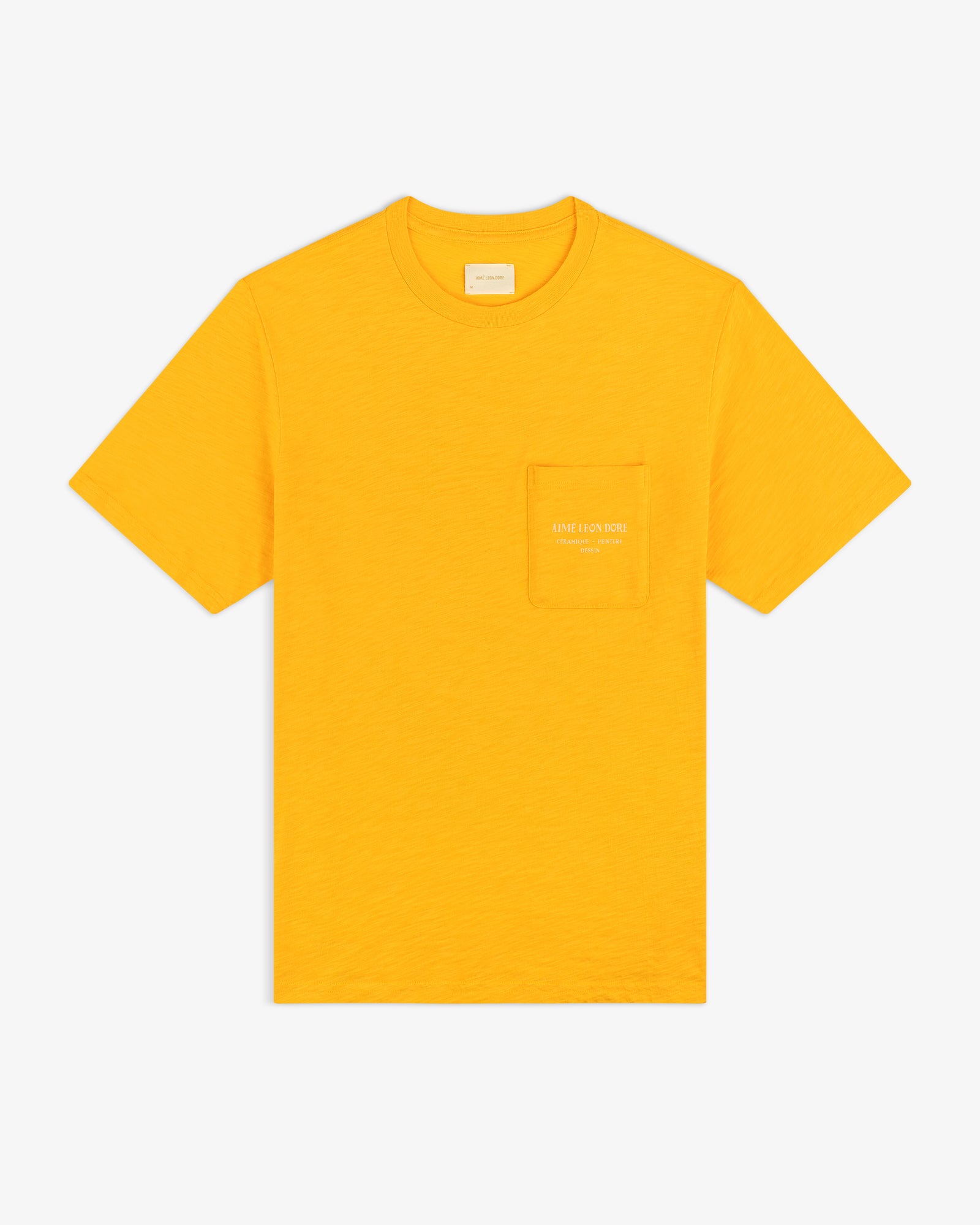Artiste Pocket Tee: bright yellow short-sleeve shirt with chest pocket and subtle logo text on the pocket.