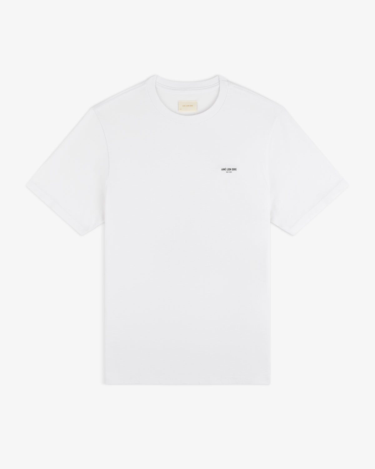 Mott Street Tee: plain white short-sleeve shirt with a subtle black text detail on the left chest.