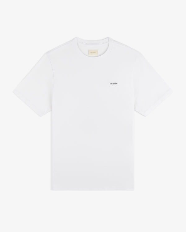 Mott Street Tee: plain white short-sleeve shirt with a subtle black text detail on the left chest.
