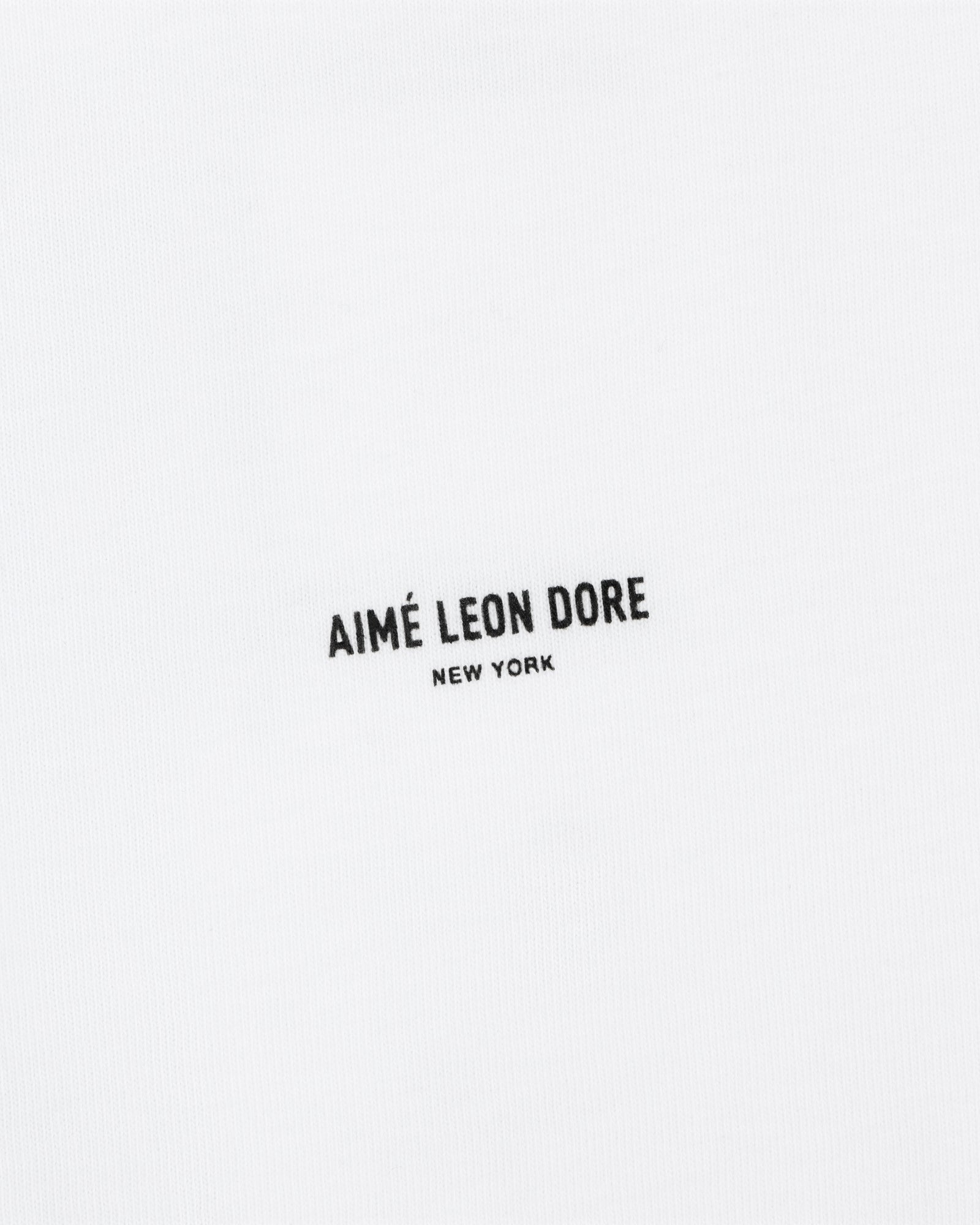 White Mott Street Tee with "AIMÉ LEON DORE NEW YORK" in small black uppercase letters at the center.