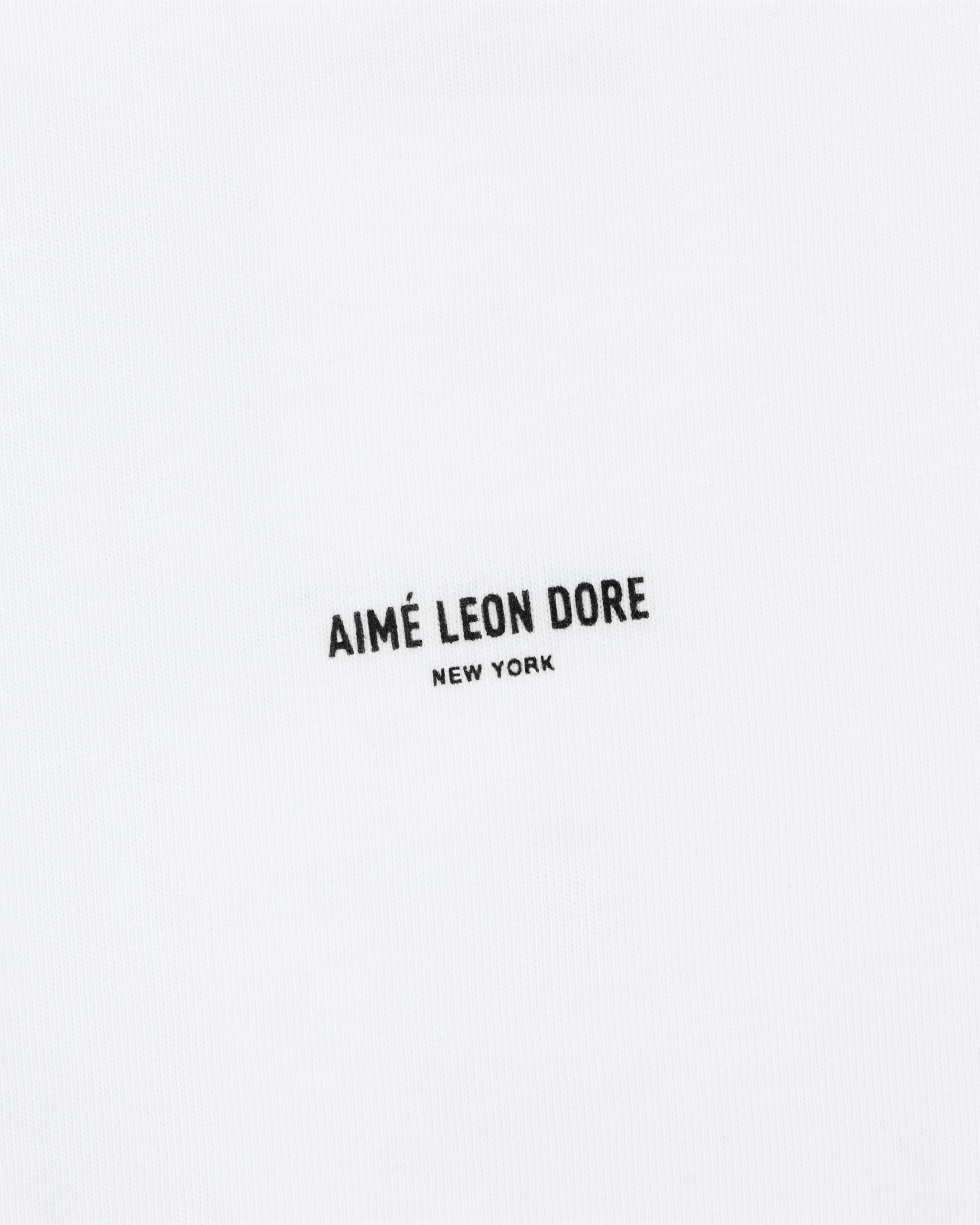 White Mott Street Tee with "AIMÉ LEON DORE NEW YORK" in small black uppercase letters at the center.