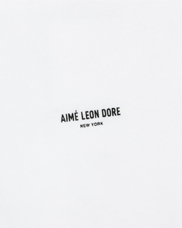 White Mott Street Tee with "AIMÉ LEON DORE NEW YORK" in small black uppercase letters at the center.