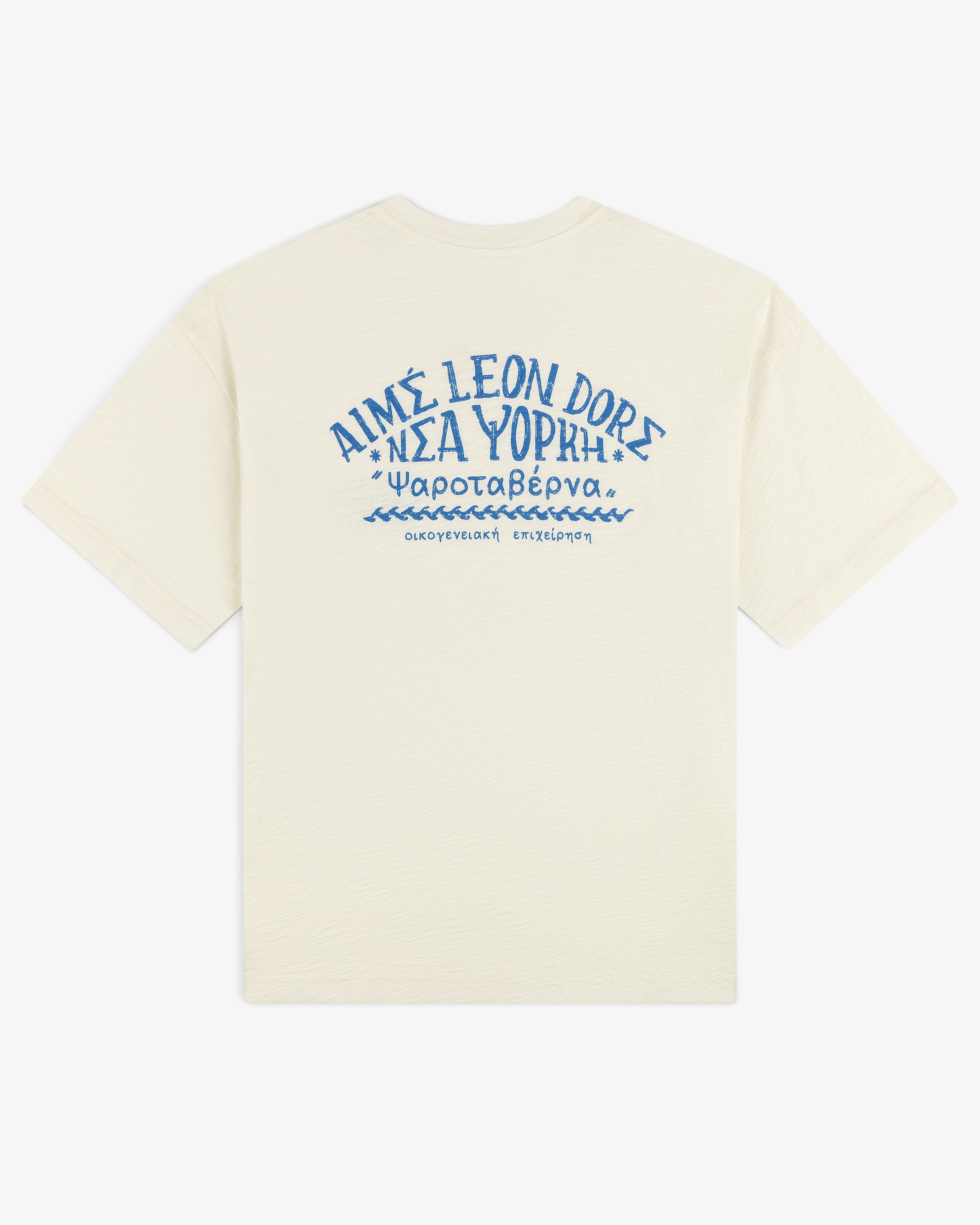 Off-white Taverna Tee with blue Greek text and AIMÉ LEON DORE printed on the upper back.