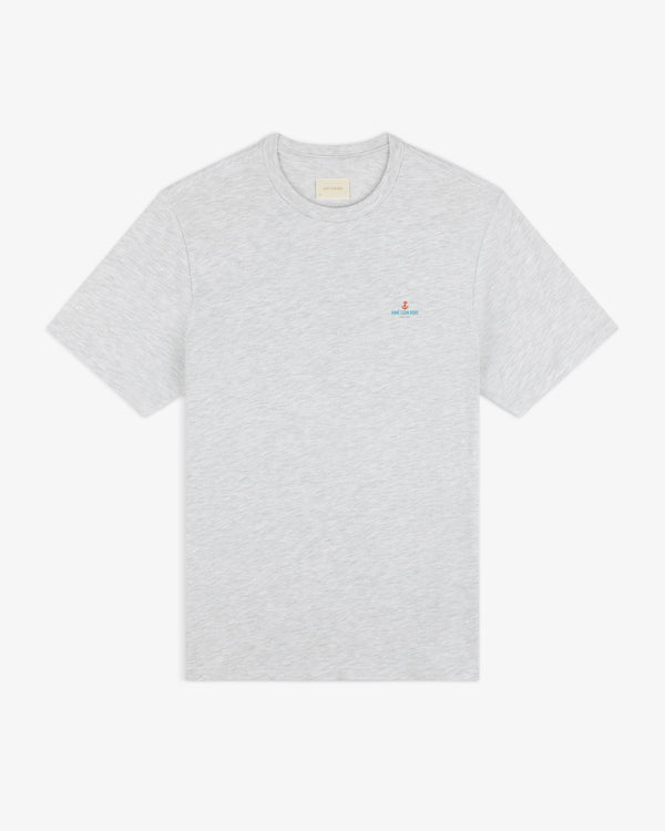 Light gray Coastal Flag Tee with short sleeves and a small embroidered logo and text on the left chest.