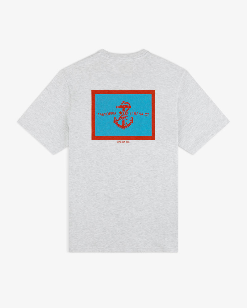 Coastal Flag Tee: Light gray shirt with blue/red anchor and Greek text on back, outlined by a red rectangle.