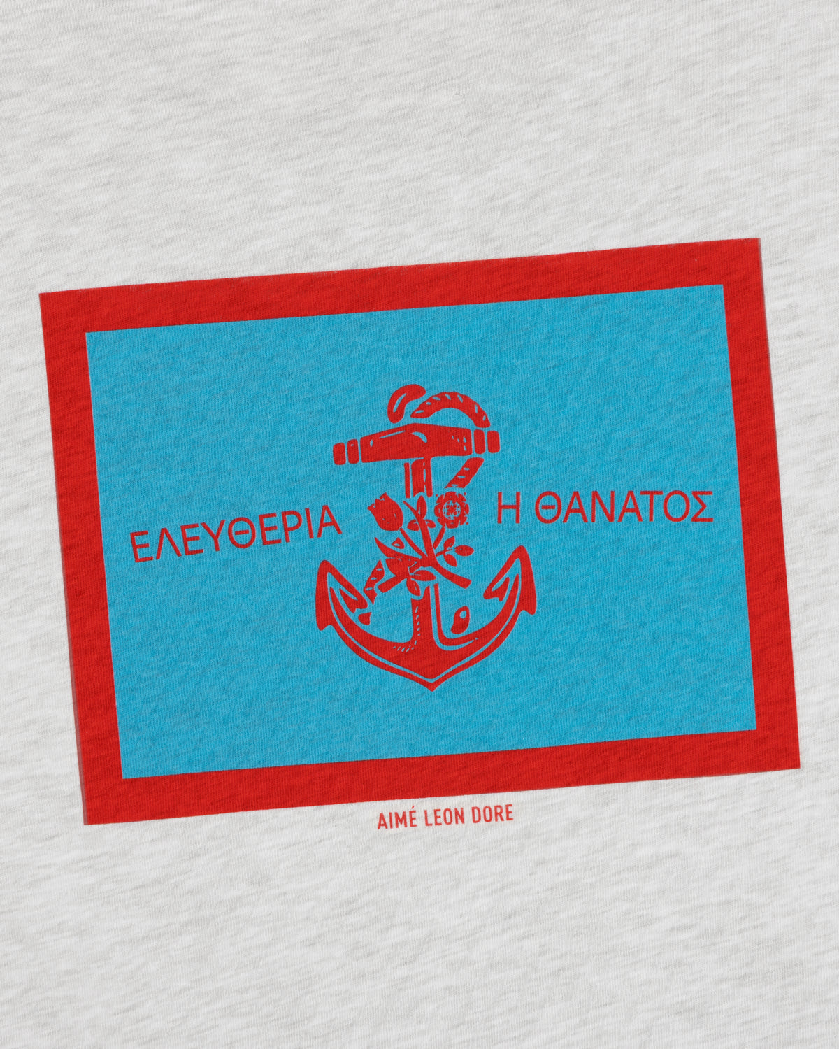 AIMÉ LEON DORE Coastal Flag Tee: Blue rectangle, red anchor & Greek text on light gray with red border.