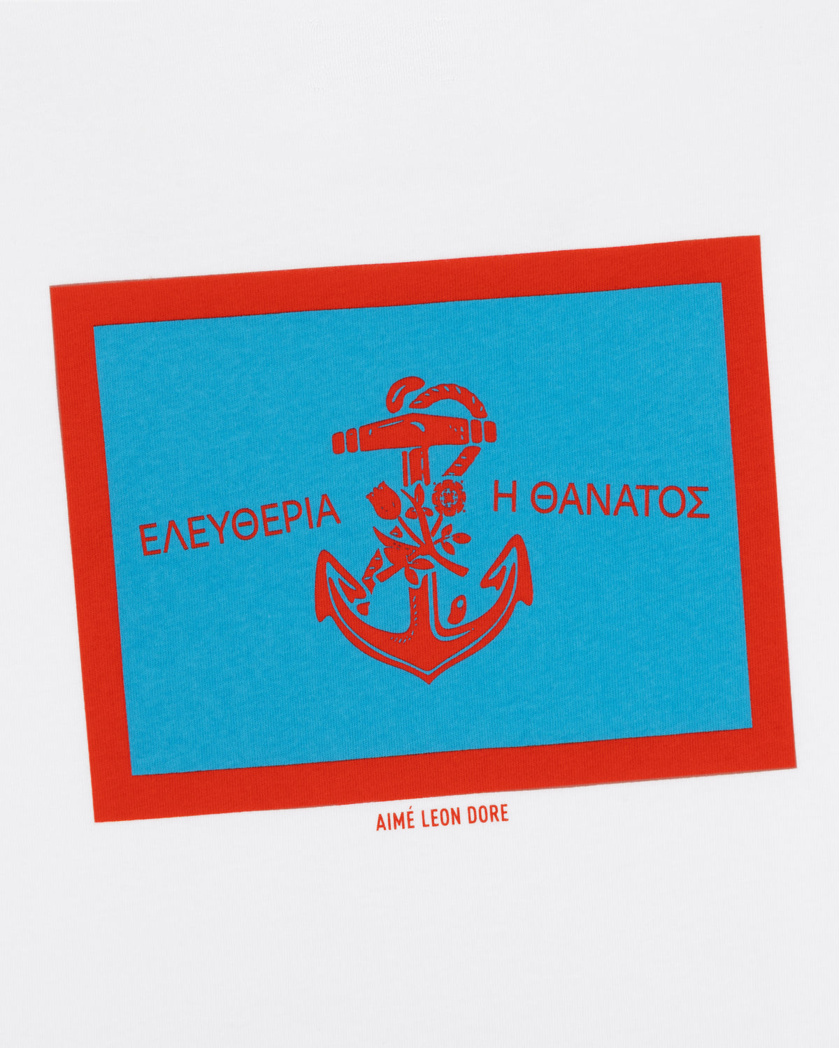 A blue and red anchor and Greek text with “Aimé Leon Dore” appear on the Coastal Flag Tee’s white background.