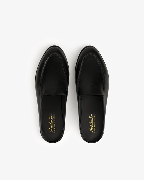 The Venetian Mule in black leather, slip-on loafers shown from above on a white background.