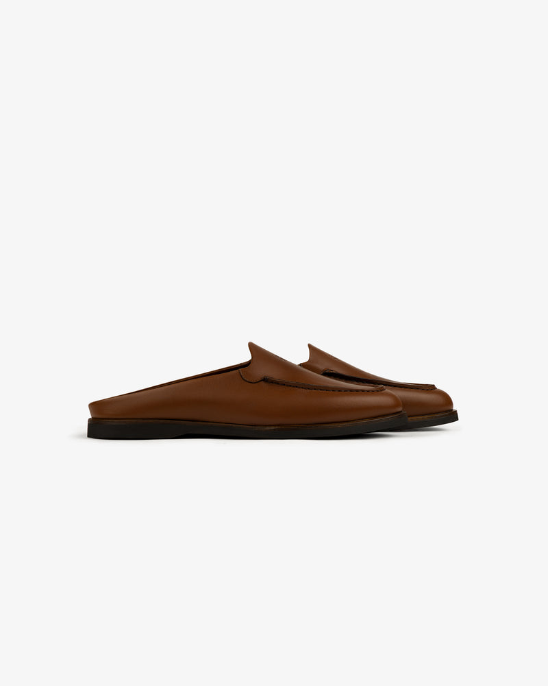 Venetian Mule brown leather slip-on loafers with black soles, side view on a white background.