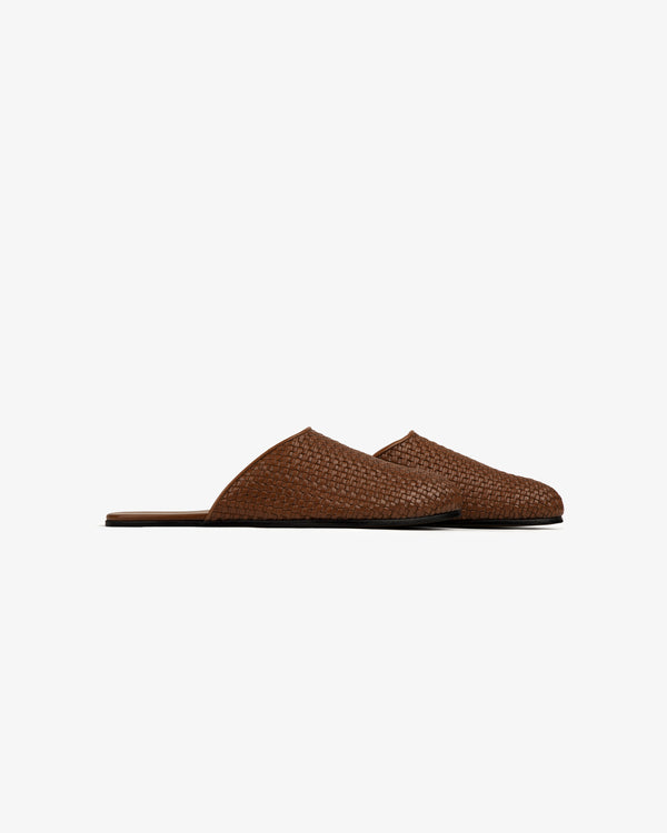 Leather Raffia Mule slippers with flat soles, shown in profile on a plain white background.