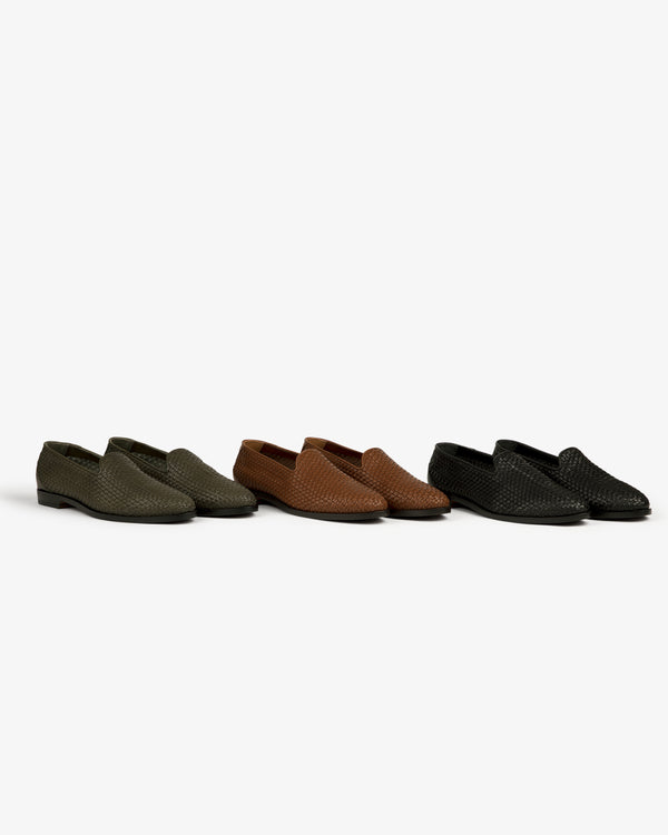 Three Leather Raffia Loafers in green, brown, and black are arranged side by side on a white background.
