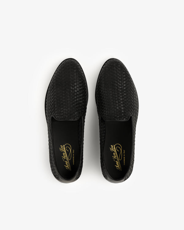 Black Leather Raffia Loafers with gold insole writing, shown from above on a white background.