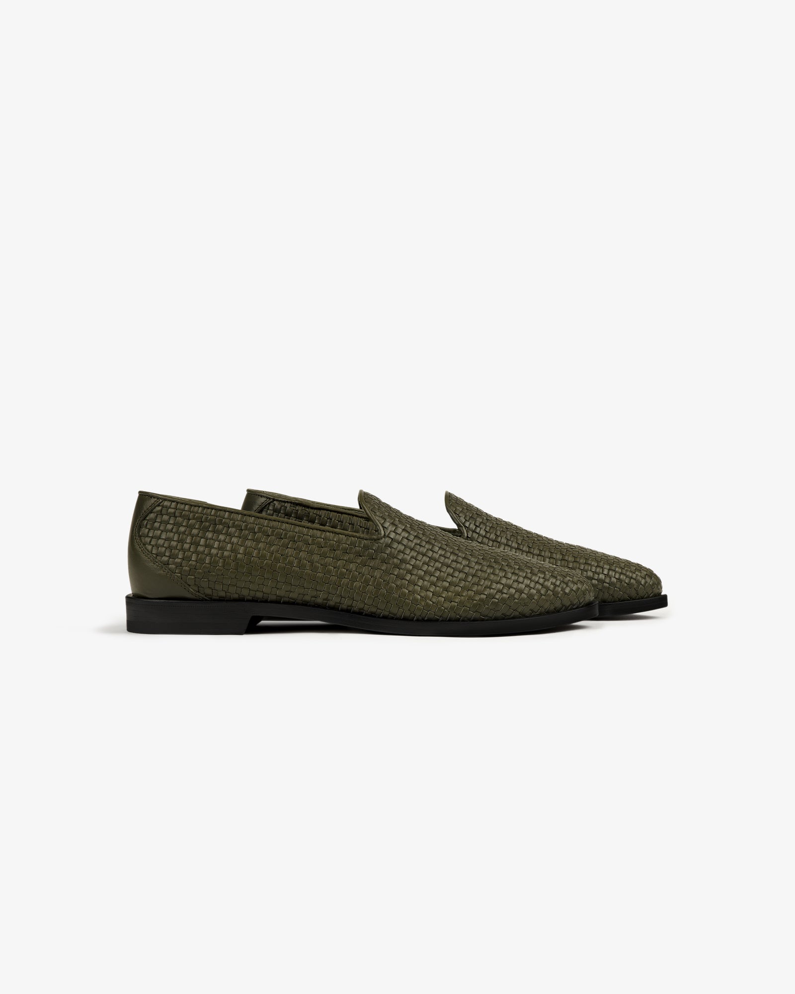 A pair of Leather Raffia Loafer in olive green with black soles, shown side by side on a white background.