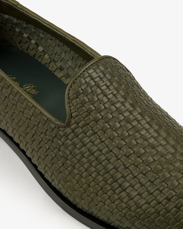 Close-up of the Leather Raffia Loafer in green, featuring woven texture, detailed stitching, and a black sole.