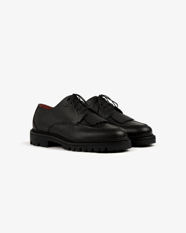 Leather Lug Sole Derby in black textured leather with chunky soles, shown on a white background.