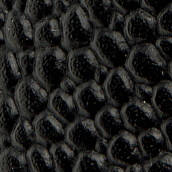 Close-up of the Leather Lug Sole Derby's black, textured surface with a reptile-like, scale pattern.