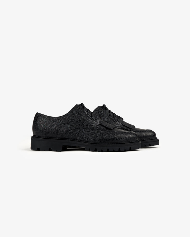 Leather Lug Sole Derby shoes in black leather with chunky rubber soles, shown on a plain white background.