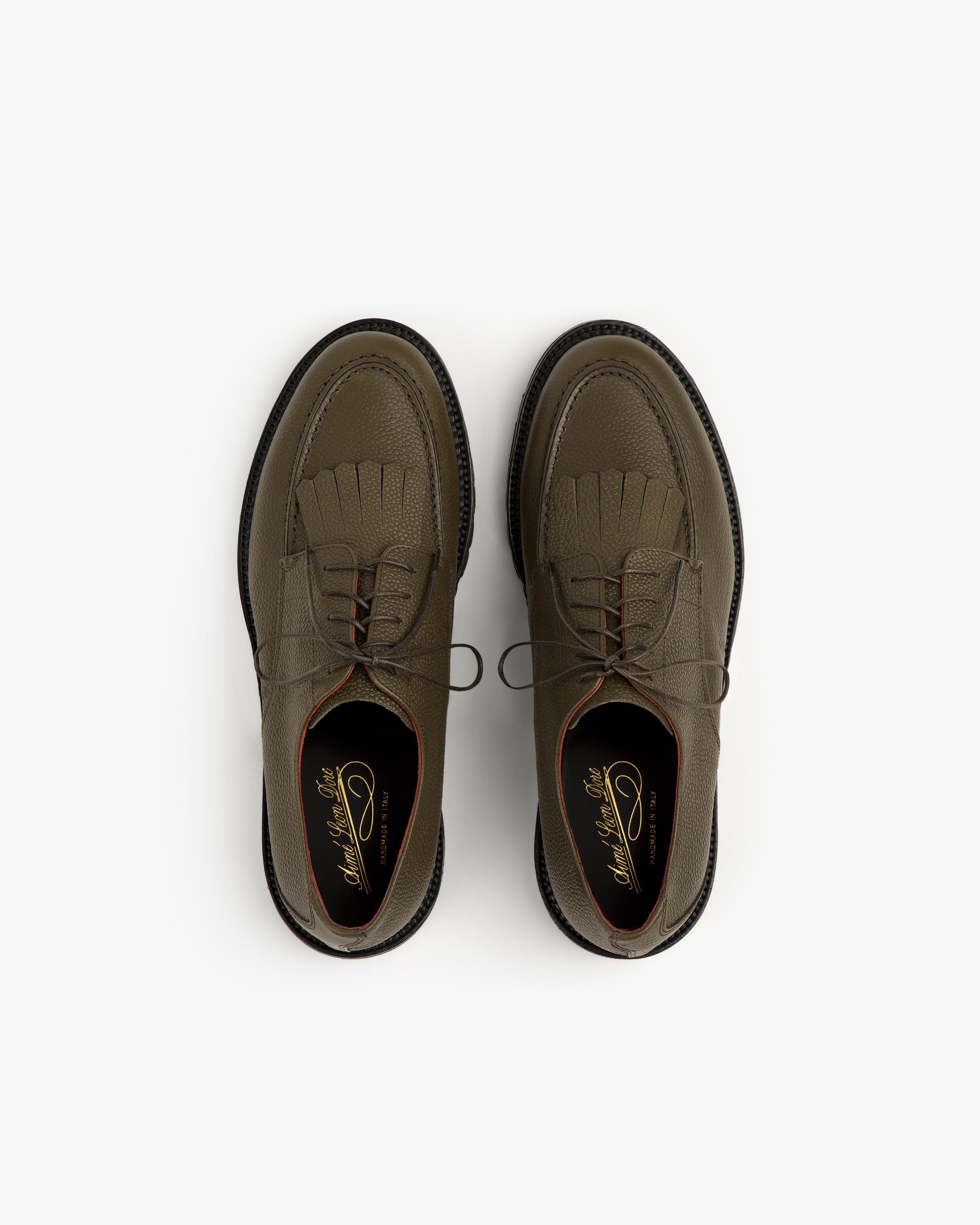 Olive green Leather Lug Sole Derby shoes with laces, viewed from above on a white background.