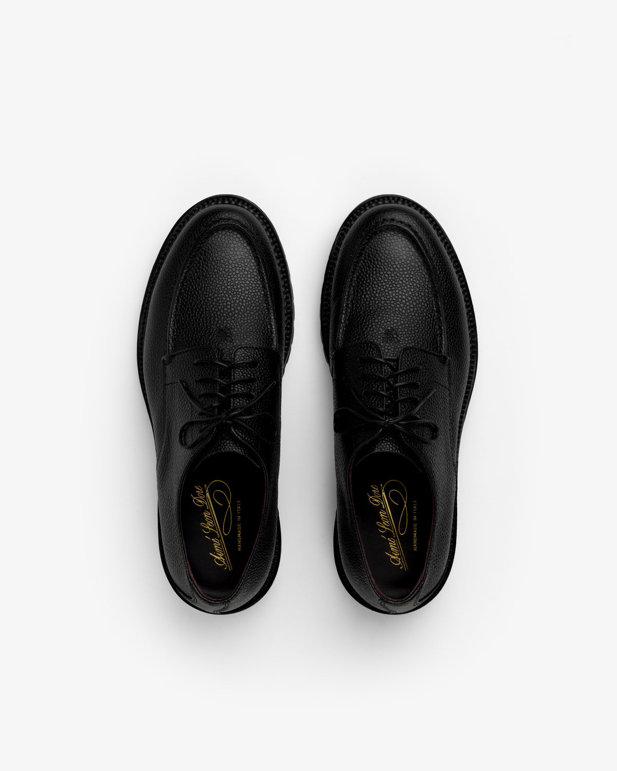Top-down view of Leather Lug Sole Derby shoes in black textured leather with thick lug soles.