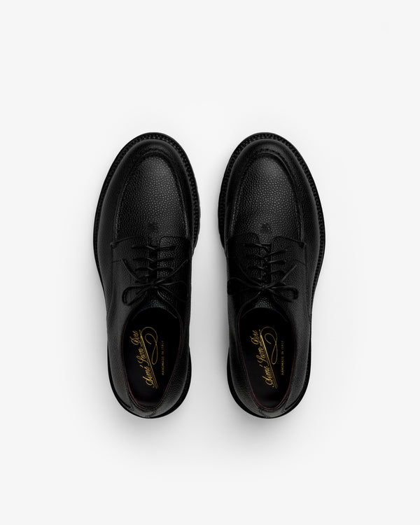 Top-down view of Leather Lug Sole Derby shoes in black textured leather with thick lug soles.
