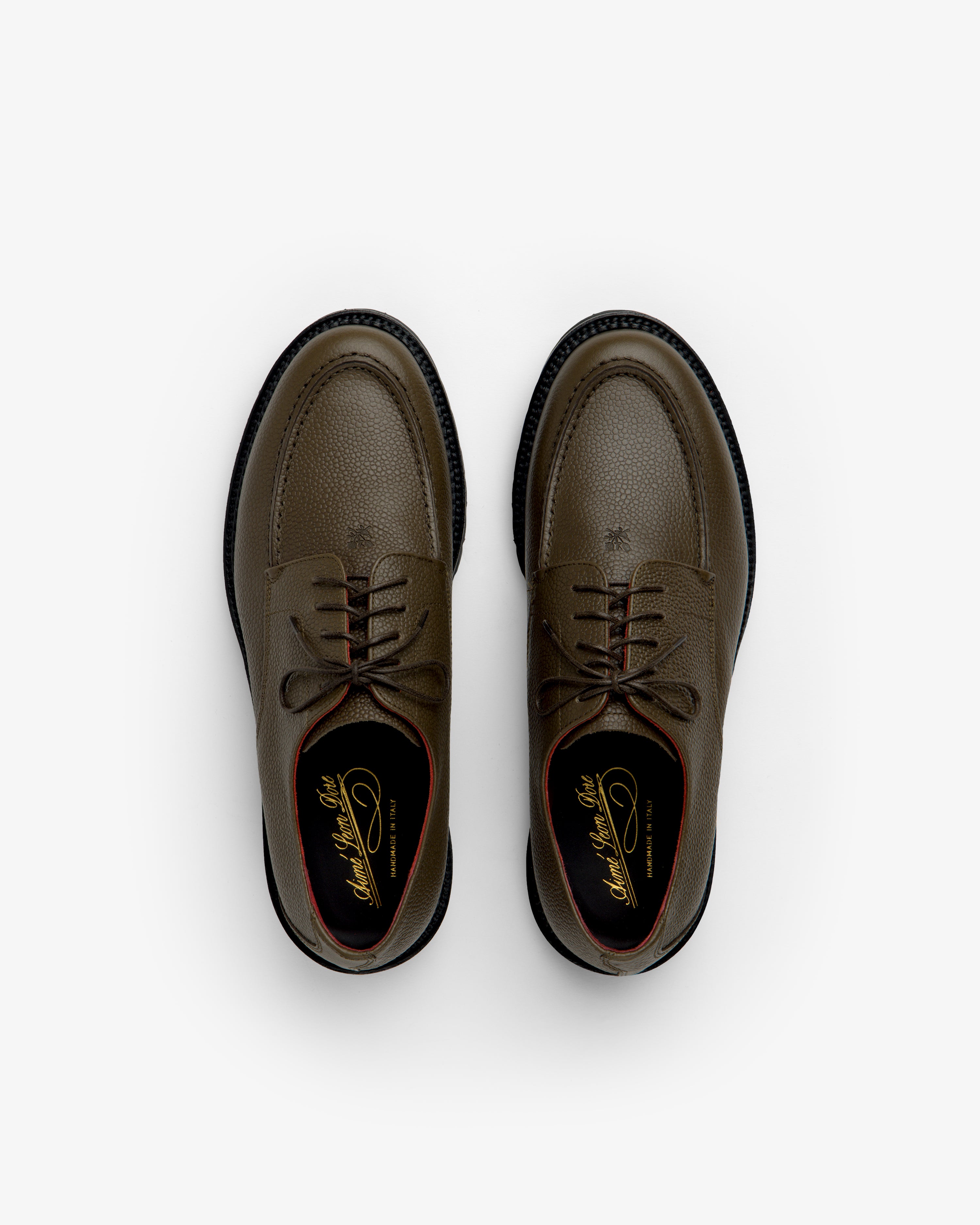 Top-down view of olive green Leather Lug Sole Derby shoes with brown laces and thick lug soles.