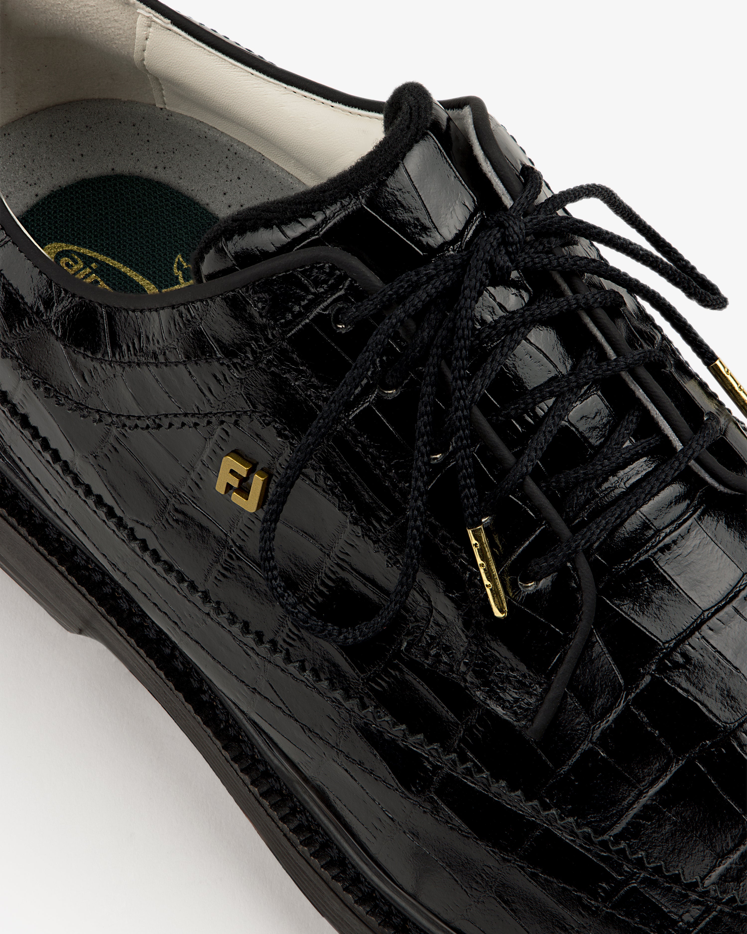 Close-up of the ALD / Footjoy Croc-Embossed Premiere Series Marquis dress shoe with gold FJ logo on the side.