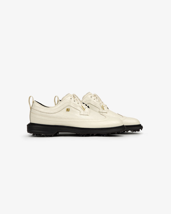 The ALD / Footjoy Croc-Embossed Premiere Series Marquis shoes in off-white leather with black soles, side by side.