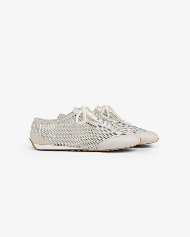 A pair of beige and white Low Profile Mesh Trainer sneakers with white laces on a white background.
