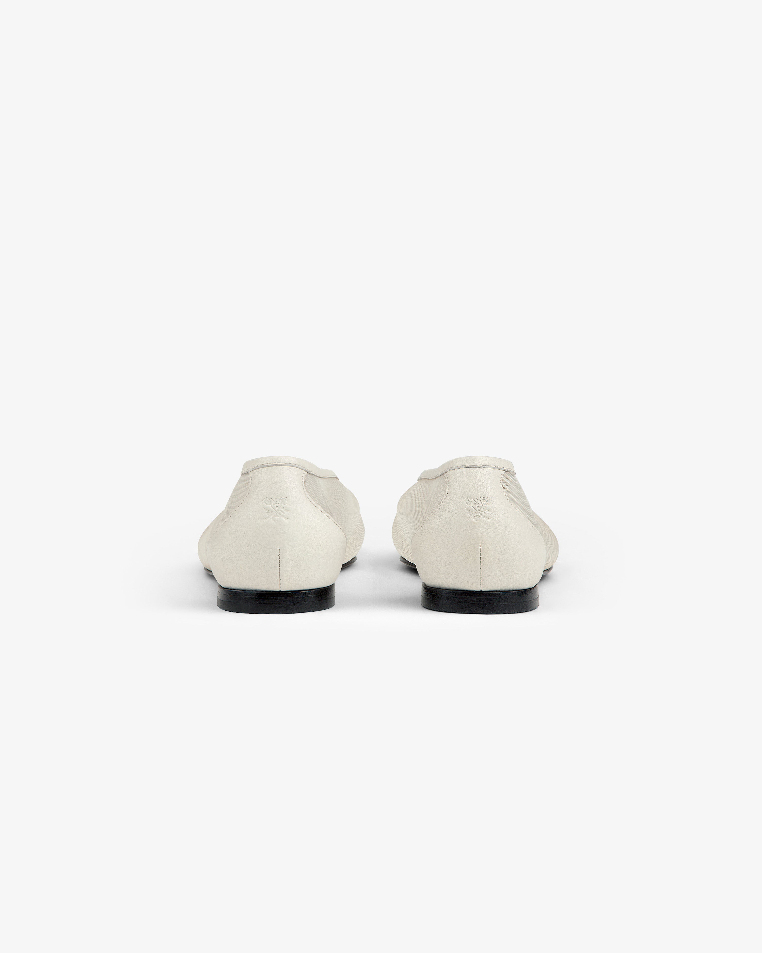 A pair of white Mesh Ballet Flats seen from the back against a plain white background.