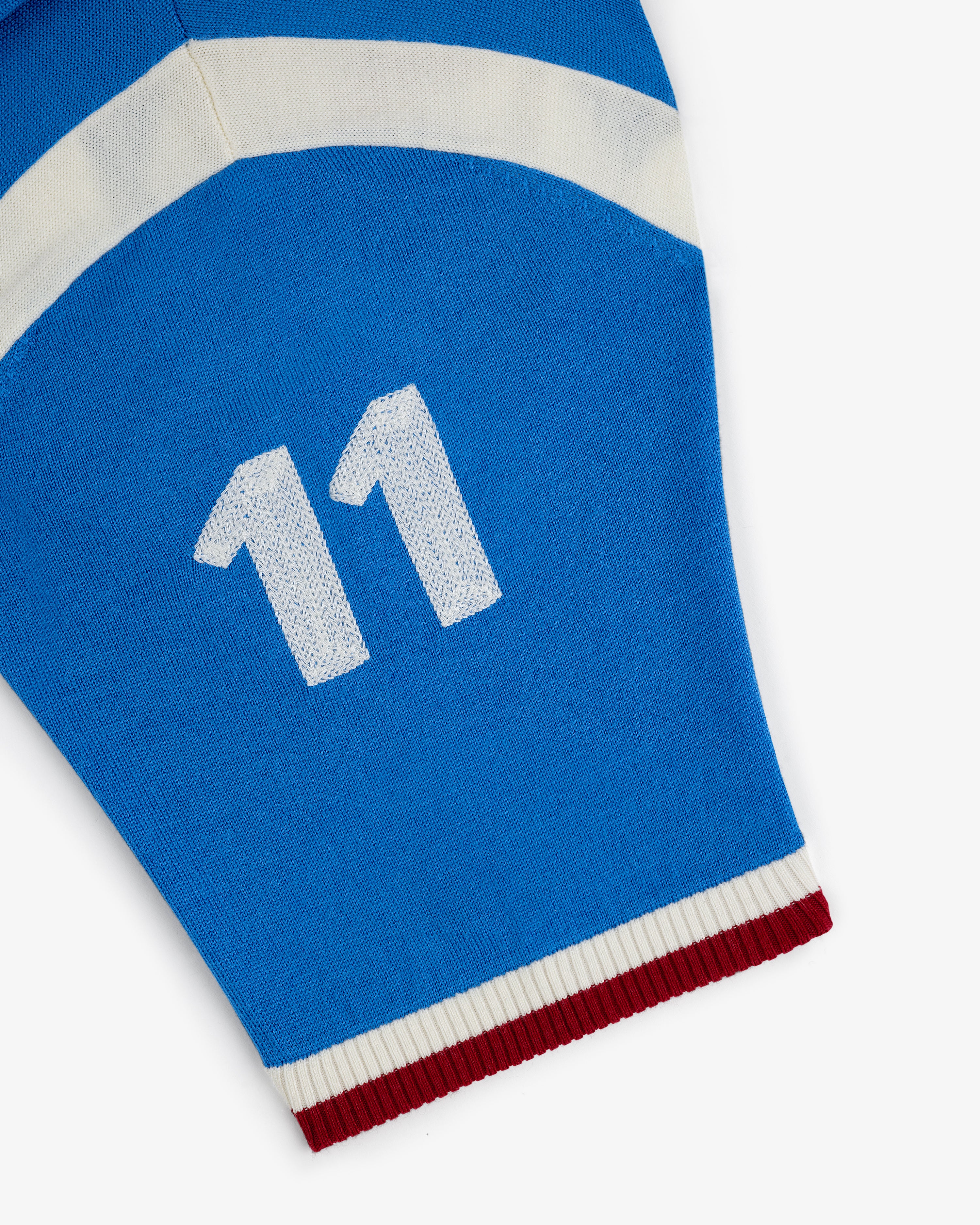 Merino Wool Cycling Jersey: Blue with white 11, white stripe, and red-and-white ribbed cuff.