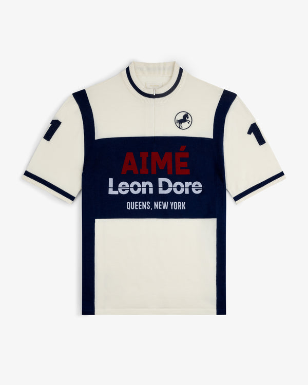 Short-sleeve cream and navy Merino Wool Cycling Jersey with AIMÉ Leon Dore QUEENS, NEW YORK text and front logo.