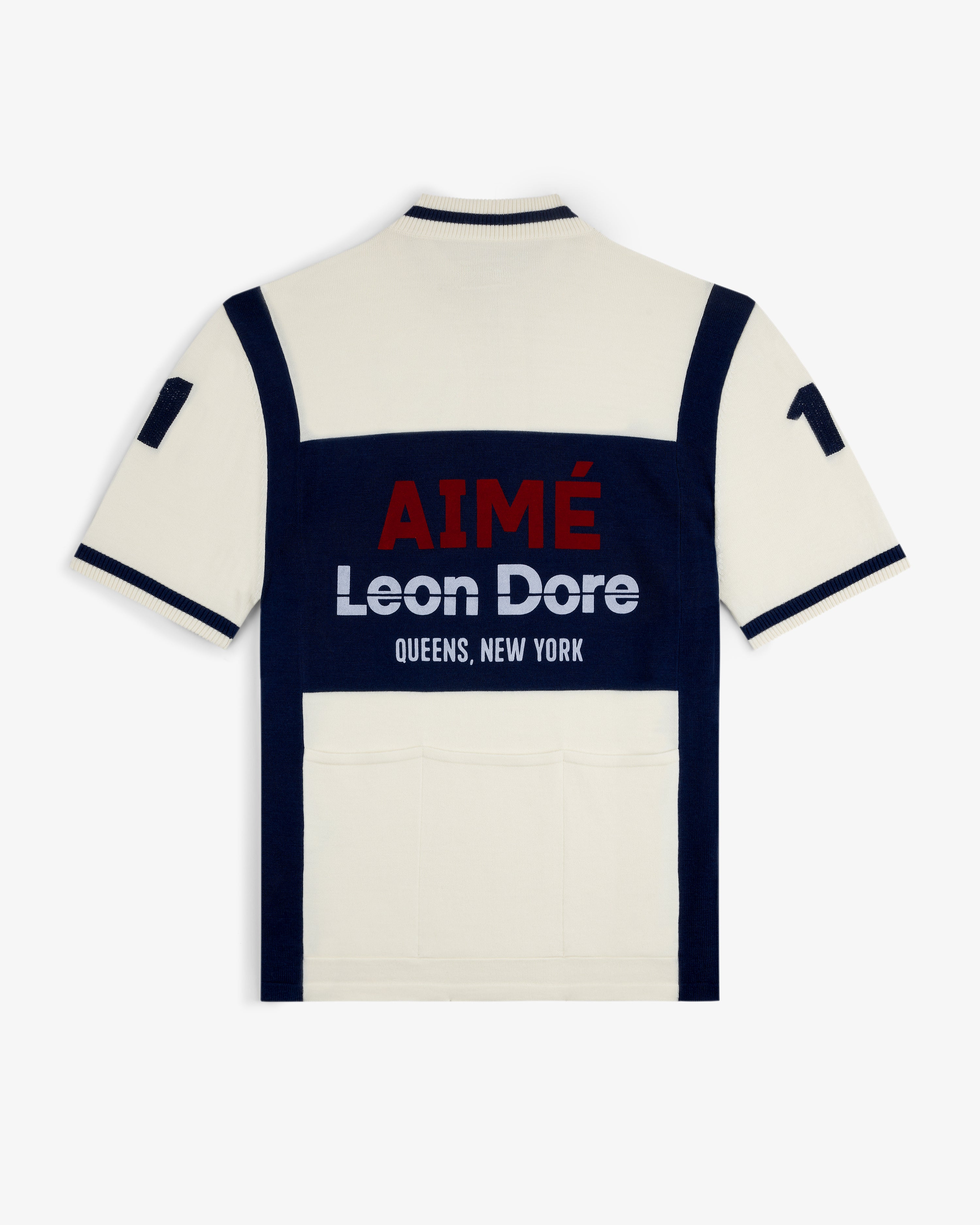 Back of a Merino Wool Cycling Jersey in cream and navy with AIMÉ Leon Dore QUEENS, NEW YORK and 17 on the sleeve.