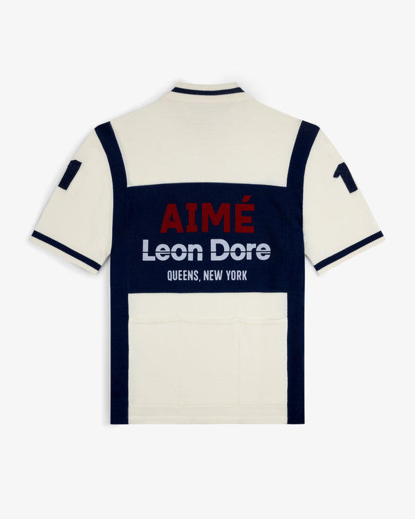 Back of a Merino Wool Cycling Jersey in cream and navy with AIMÉ Leon Dore QUEENS, NEW YORK and 17 on the sleeve.