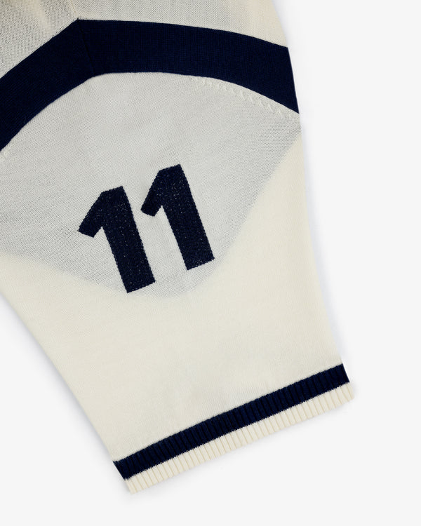 A Merino Wool Cycling Jersey in white with navy stripes and the number 11 printed in navy.