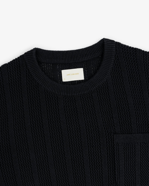 Racking Stitch Crewneck Sweater in black, textured knit with a chest pocket, shown on a white background.