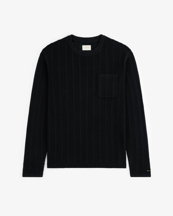 The Racking Stitch Crewneck Sweater in black with long sleeves and chest pocket, shown flat on a white background.
