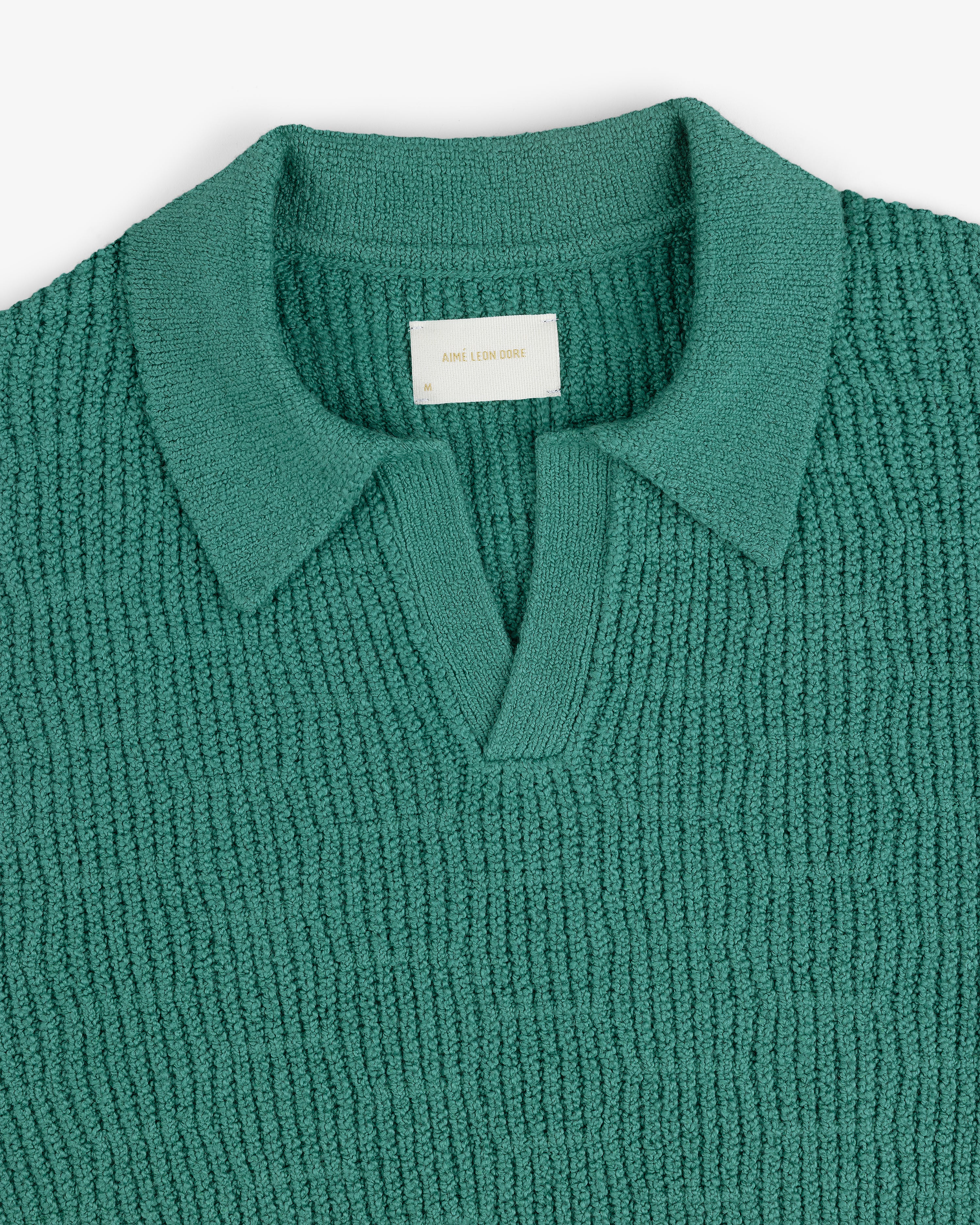 Long-Sleeve Boucle Polo in teal with a V-neck and collar, displayed flat on a white background.