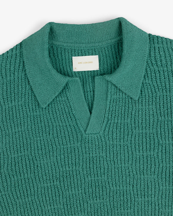 Long-Sleeve Boucle Polo in teal with a V-neck and collar, displayed flat on a white background.