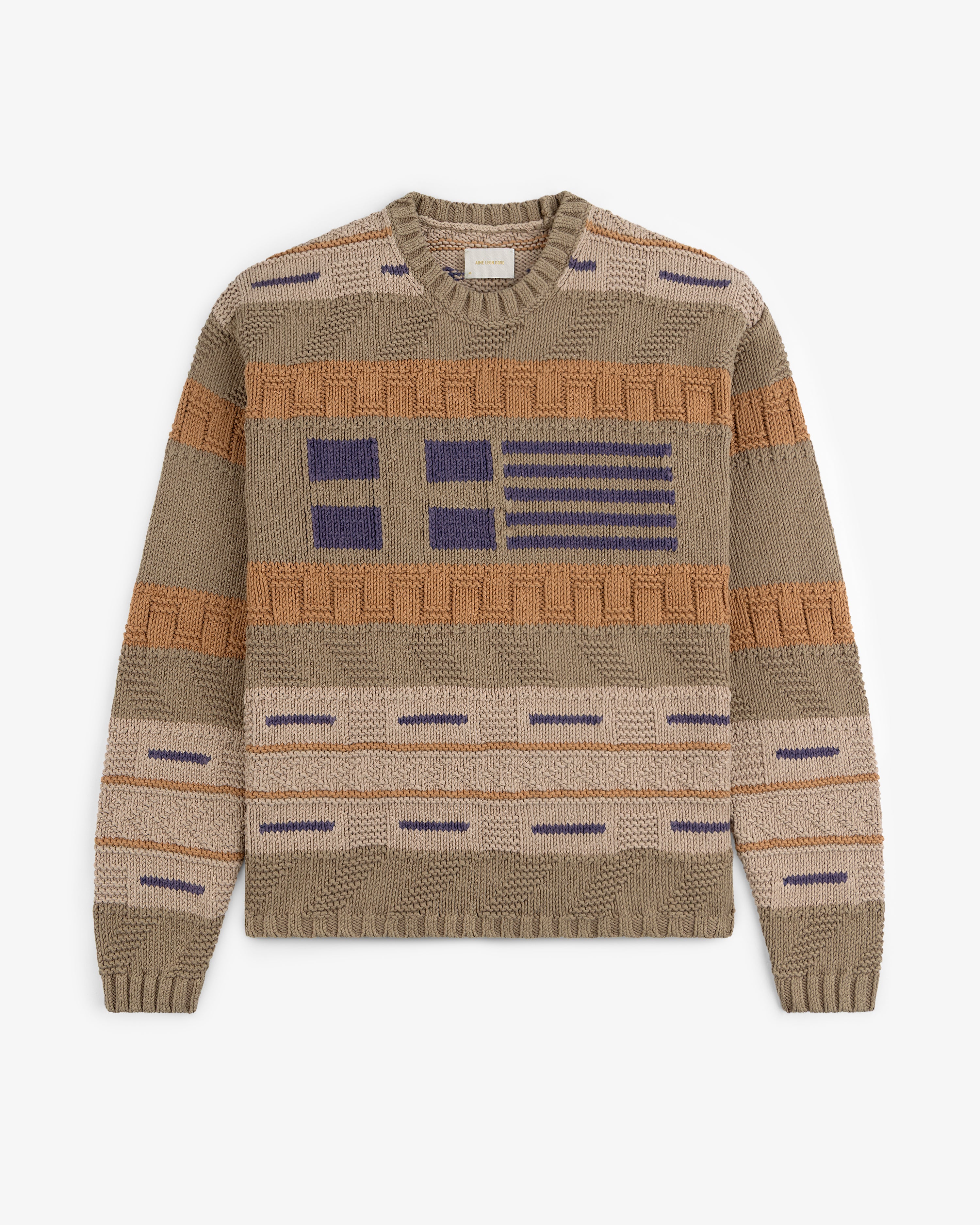 The Simaía Crewneck Sweater features beige knit with blue and brown geometric stripes and blocks on front and sleeves.