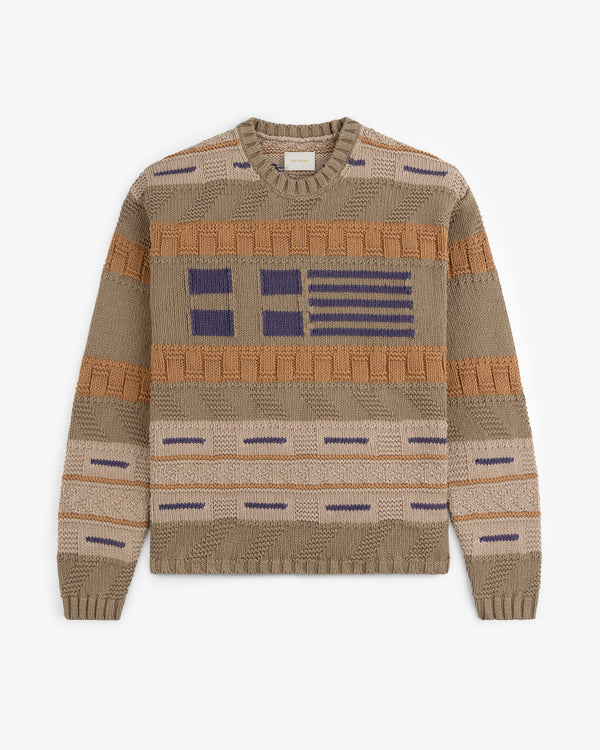 The Simaía Crewneck Sweater features beige knit with blue and brown geometric stripes and blocks on front and sleeves.