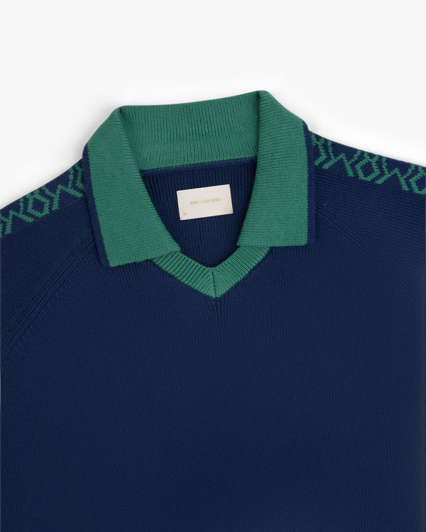 Navy Knit Sport Pullover with green collar and green patterned shoulder detailing.