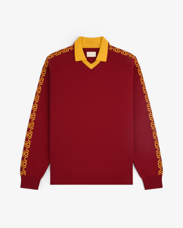 The Knit Sport Pullover is a maroon long-sleeve sweater with a yellow collar and yellow striped sleeves.