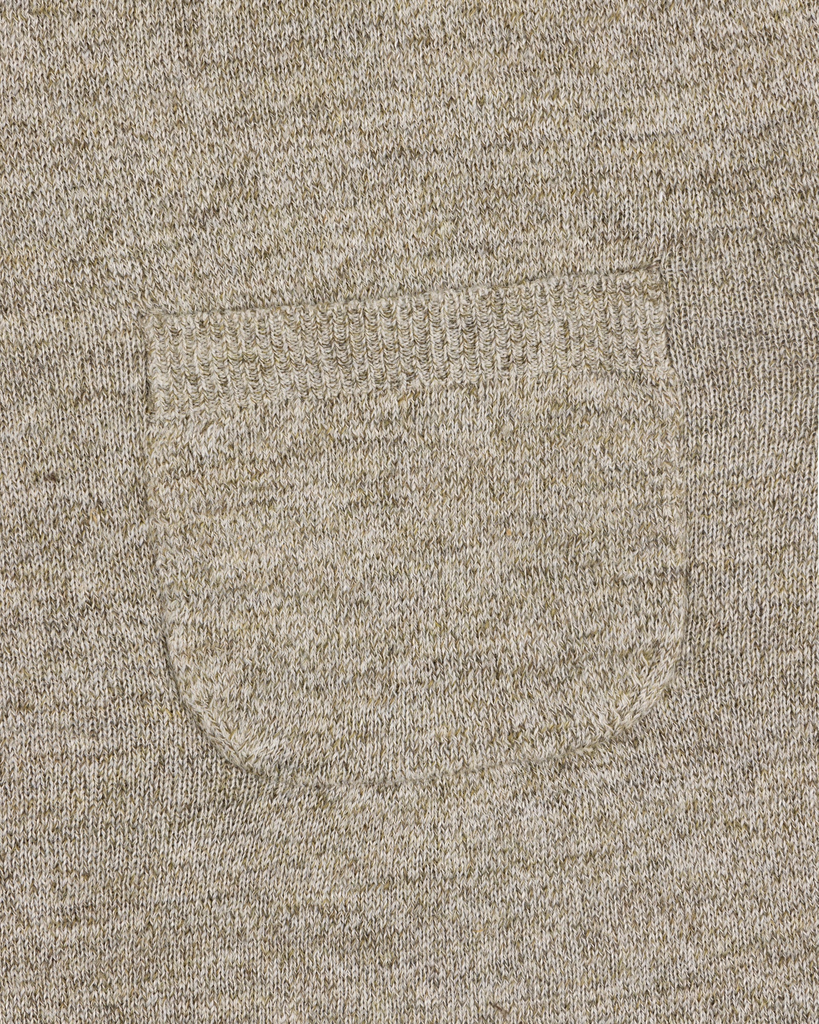 Close-up of a small sewn pocket on the Long-Sleeve Knit Pocket Tee, highlighting beige knit texture and stitching.