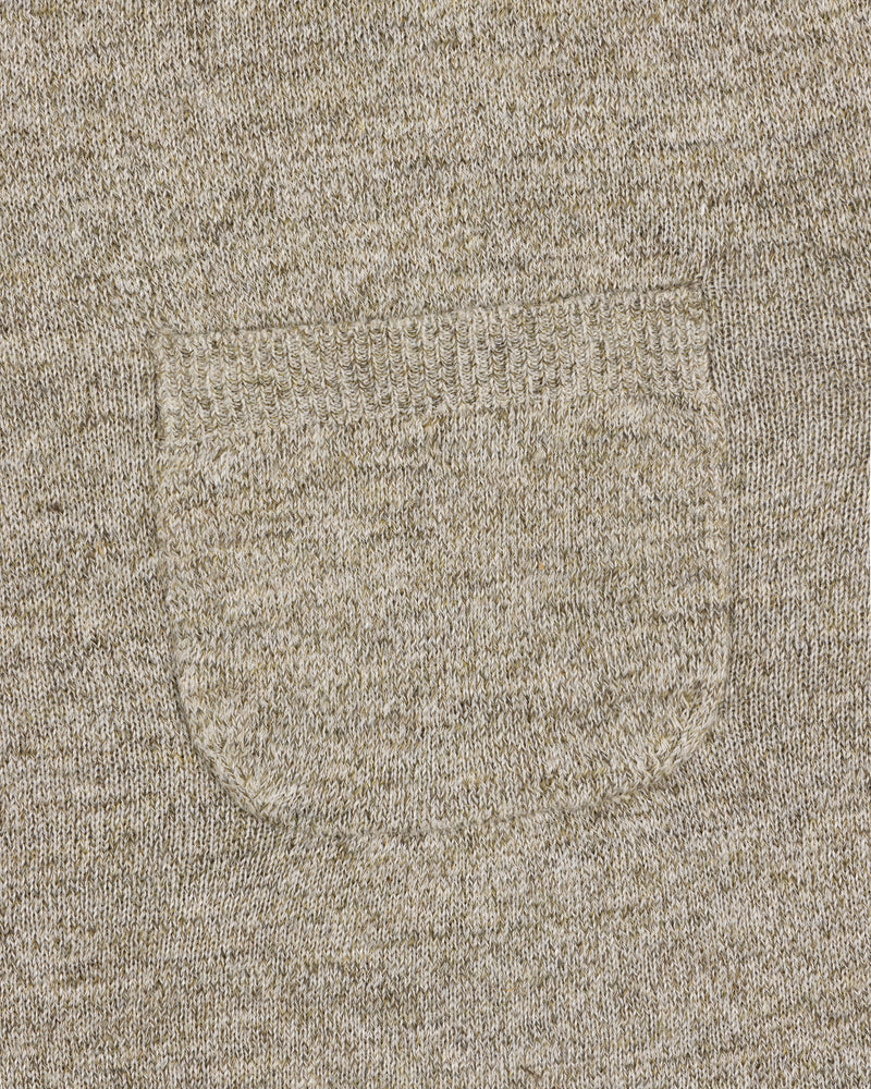 Close-up of a small sewn pocket on the Long-Sleeve Knit Pocket Tee, highlighting beige knit texture and stitching.