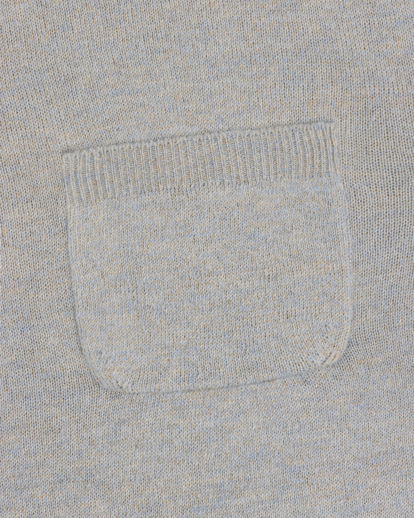 Close-up of the square patch pocket on the Long-Sleeve Knit Pocket Tee in light gray knit fabric.