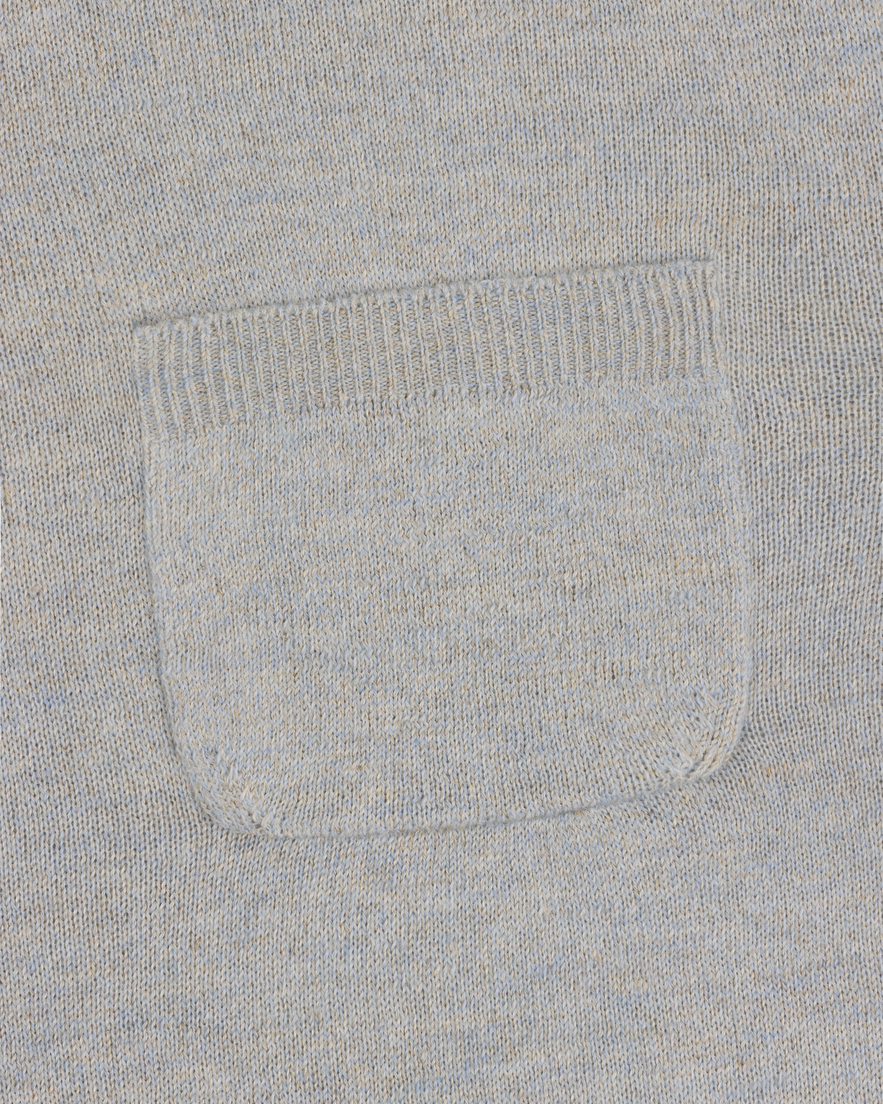 Close-up of the square patch pocket on the Long-Sleeve Knit Pocket Tee in light gray knit fabric.