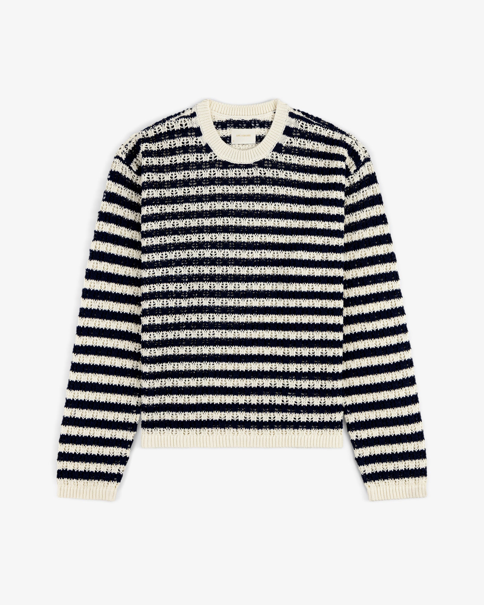 The Skáfos Sweater features long sleeves, black and white stripes, and a cream collar, cuffs, and hem.