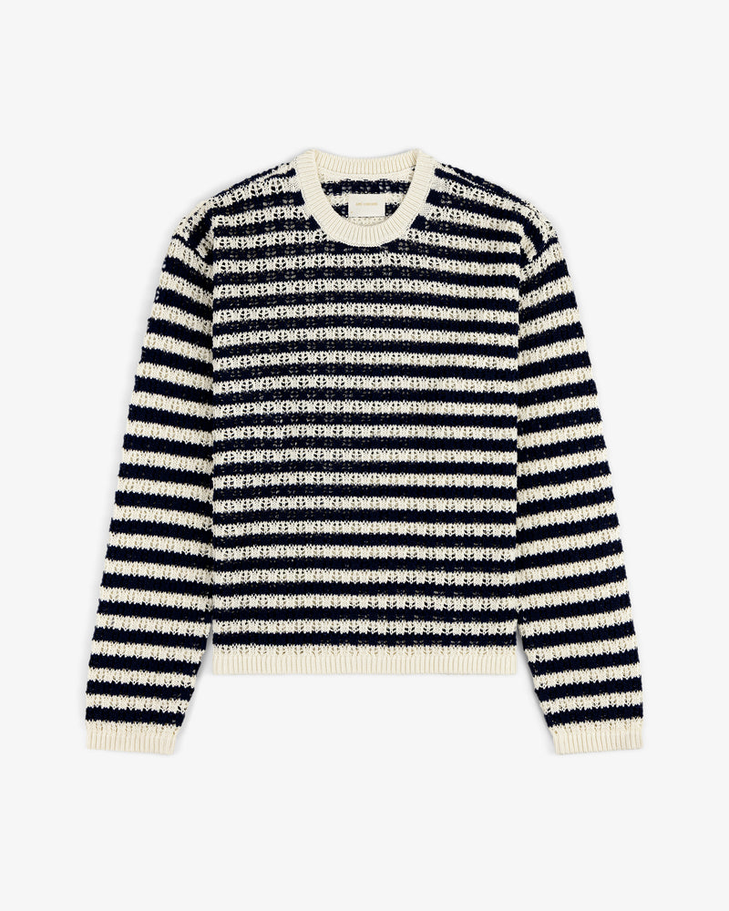 The Skáfos Sweater features long sleeves, black and white stripes, and a cream collar, cuffs, and hem.