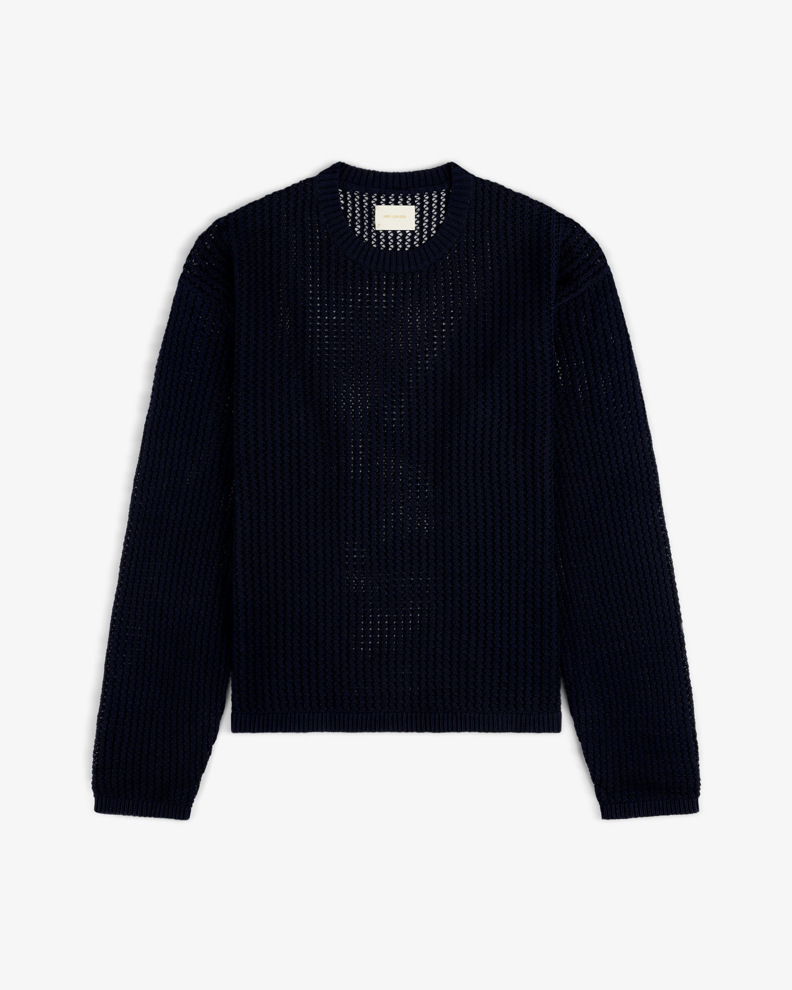 Cotton Eyelet Crewneck Sweater in navy blue with long sleeves, crochet-knit, laid flat on a white background.