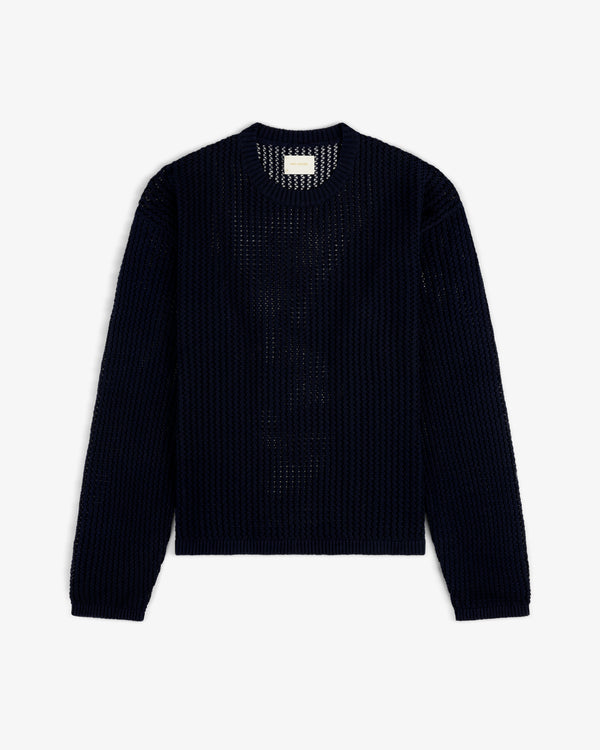 Cotton Eyelet Crewneck Sweater in navy blue with long sleeves, crochet-knit, laid flat on a white background.